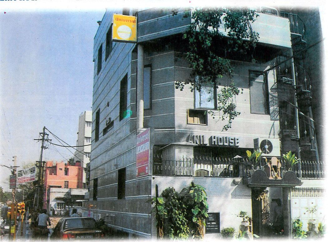 The company building, a four storey block on a street corner with the HIC sign above its entrance. The company building, a four storey block on a street corner with the HIC sign above its entrance.