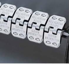 A single piece staple fastener strip pressed into the end of a belt, each plate stamped Alligator. A single piece staple fastener strip pressed into the end of a belt, each plate stamped Alligator.
