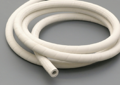 A coil of food grade steam hose in white rubber. A coil of food grade steam hose in white rubber.