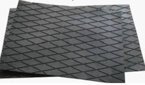 Sheets of pulley lagging rubber, a diamond pattern grooved into the face of each. Sheets of pulley lagging rubber, a diamond pattern grooved into the face of each.