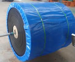 A finished roll of conveyor belting on its axle, wrapped in blue sheeting and strapped for dispatch. A finished roll of conveyor belting on its axle, wrapped in blue sheeting and strapped for dispatch.