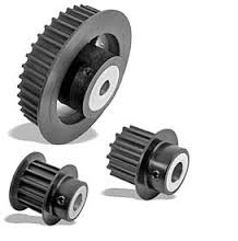 Three timing pulleys of different diameters, the teeth cut around each rim.
