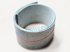 A coil of leather nylon transmission belting standing on end.
