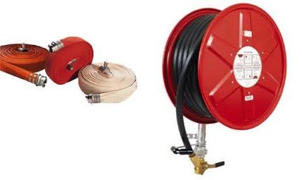 A canvas fire hose with its brass coupling, beside a red wall mounted hose reel. A canvas fire hose with its brass coupling, beside a red wall mounted hose reel.