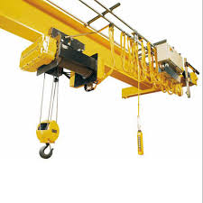 The end carriage of an overhead travelling crane, its drive shaft coupled to the gearbox. The end carriage of an overhead travelling crane, its drive shaft coupled to the gearbox.