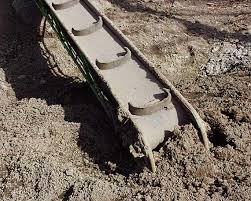 A solid plate fastened joint on a conveyor working in wet ground.