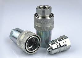 A heavy steam cleaning quick coupling standing on end, with its plug lying in front. A heavy steam cleaning quick coupling standing on end, with its plug lying in front.