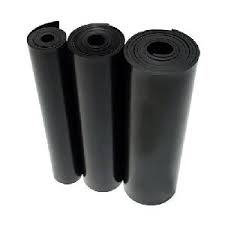 Three rolls of black electrical matting standing together. Three rolls of black electrical matting standing together.