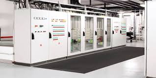 Matting laid down the aisle of a switchroom between two rows of high tension panels. Matting laid down the aisle of a switchroom between two rows of high tension panels.