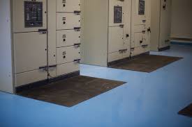 Blue safety matting on the floor of a substation, running between the panels. Blue safety matting on the floor of a substation, running between the panels.