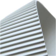 The underside of a white belt, ribbed in a fine saw tooth profile along its length.