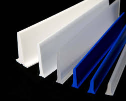 Cleat and flight profiles in white and blue, standing together to show the shapes they are made in.